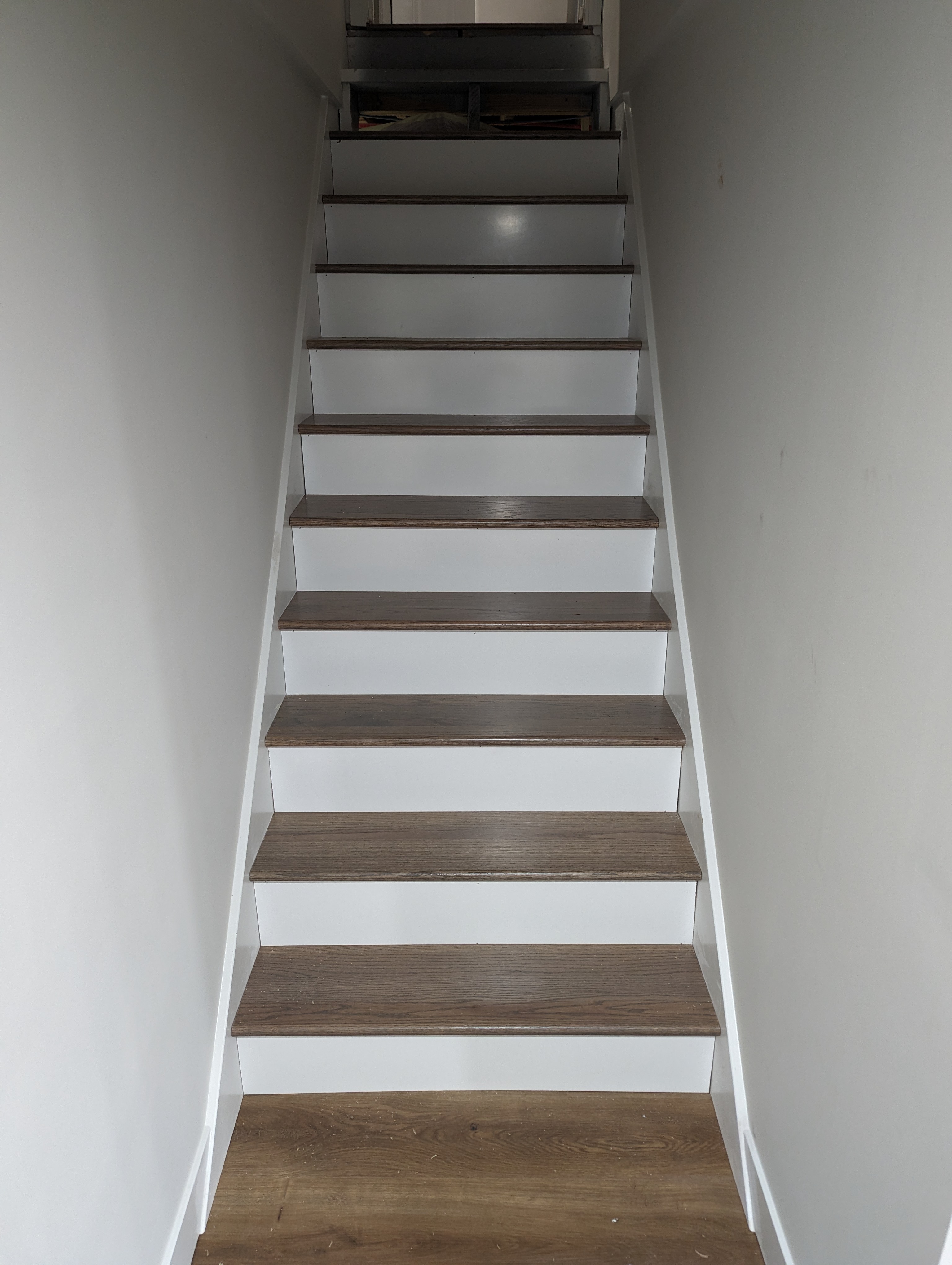 Interior stair remodel with new treads and painted risers